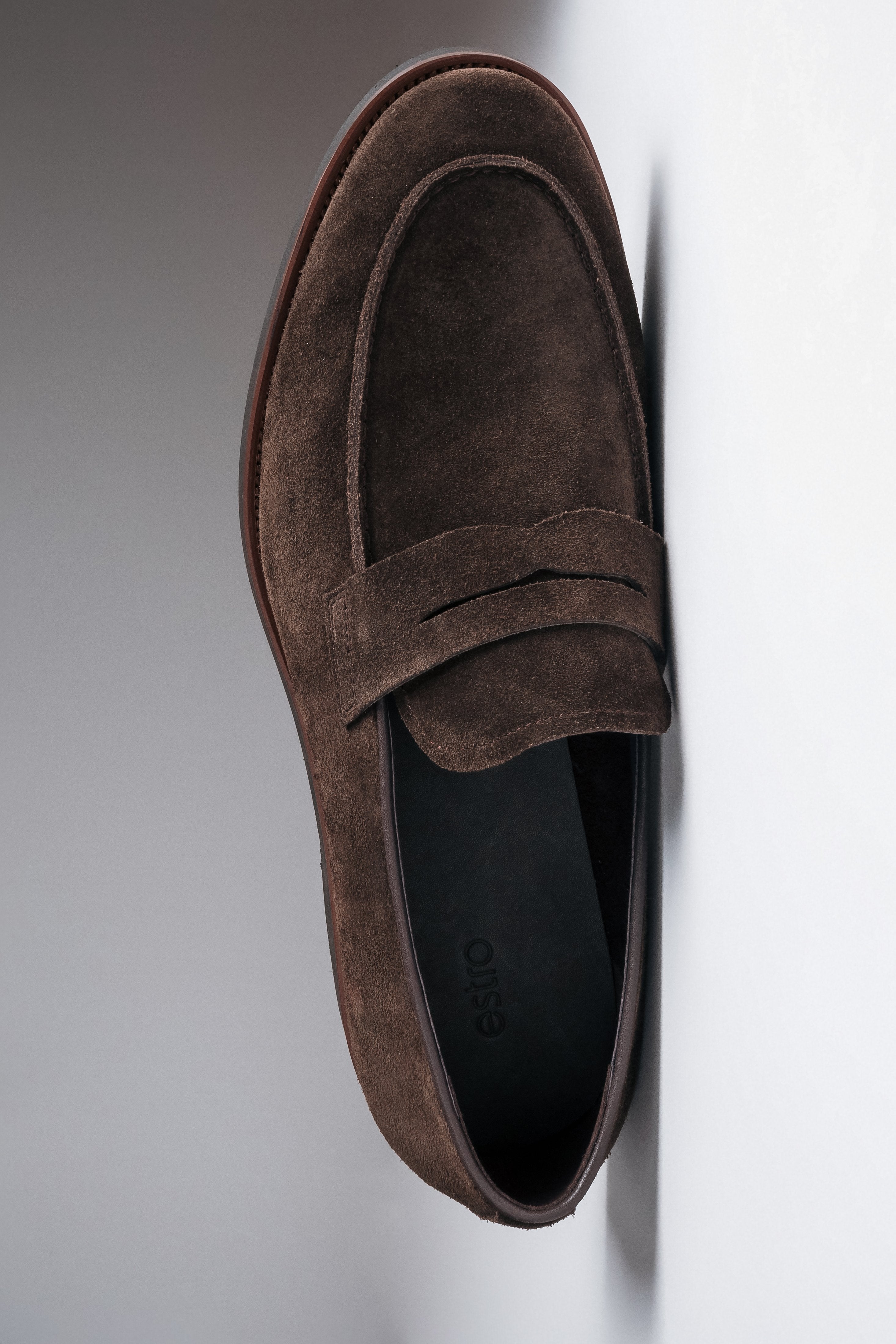 Casual dark brown loafers with a soft heel counter for everyday wear.