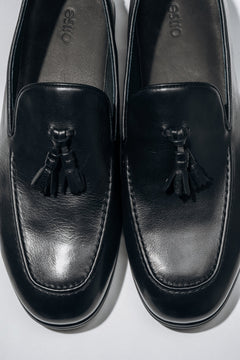 Classic black men’s loafers with a flat rubber sole.