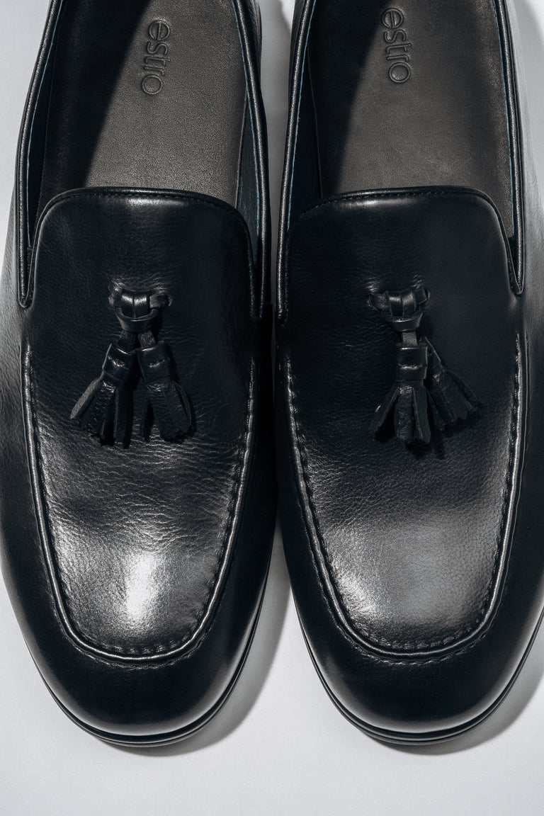 Classic black men’s loafers with a flat rubber sole.