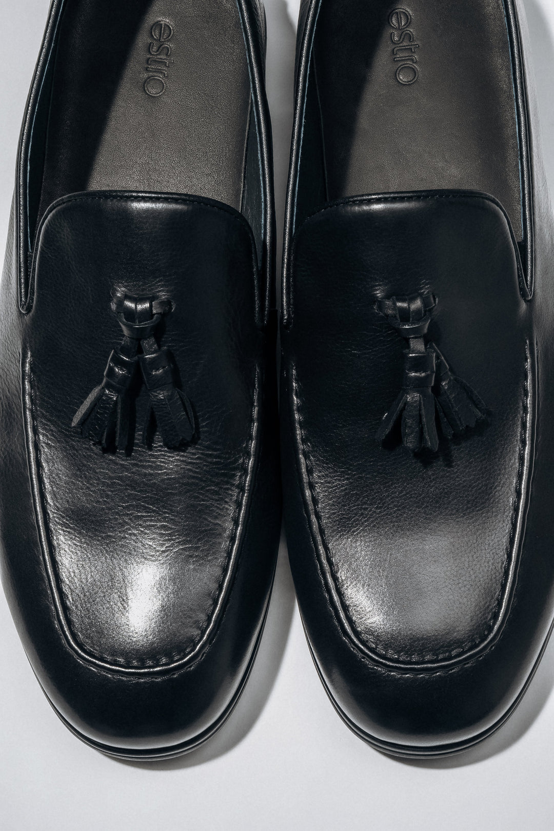 Classic black men’s loafers with a flat rubber sole.