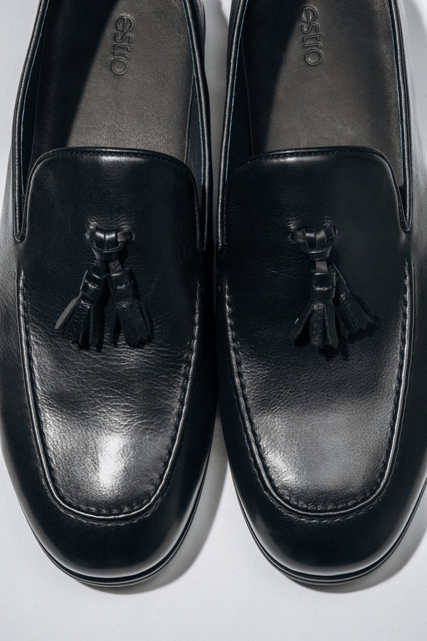 Classic black men’s loafers with a flat rubber sole.