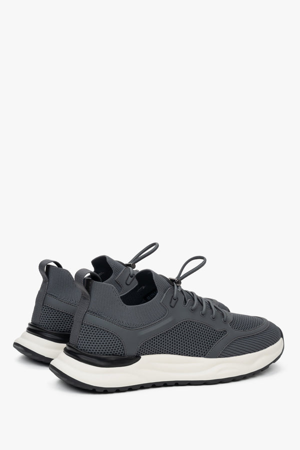 Casual spring and autumn sport sneakers in grey and white.