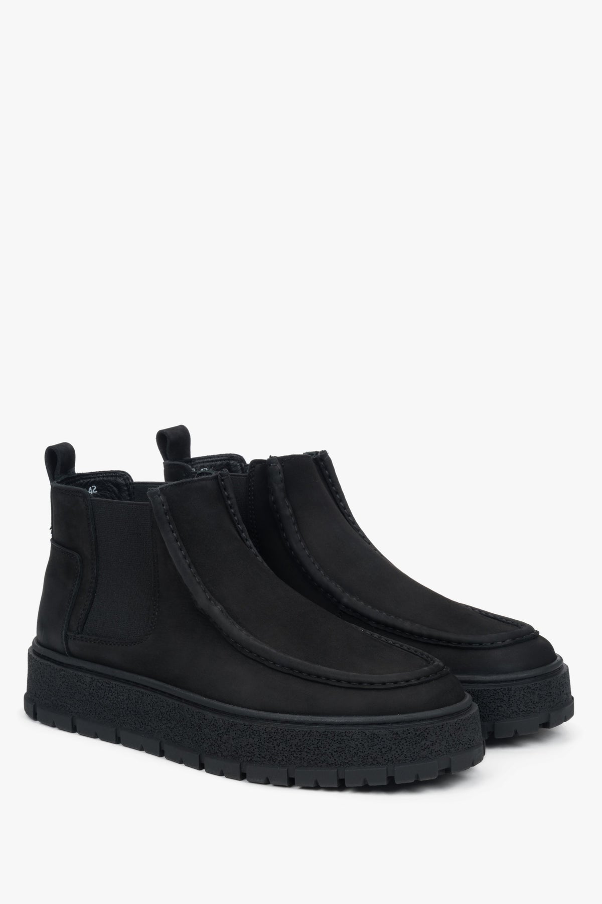 Close-up view of the men's low black Chelsea boots made of soft Italian nubuck — refined texture and elegant matte finish highlight the premium craftsmanship.