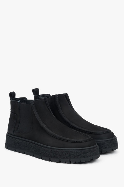 Close-up view of the men's low black Chelsea boots made of soft Italian nubuck — refined texture and elegant matte finish highlight the premium craftsmanship.