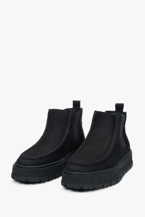 Side angle showing the smooth silhouette and elastic inserts that make these Chelsea boots easy to slip on while maintaining a perfect fit.