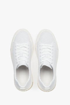 White leather lace-up sneakers with a contrasting sole insert.