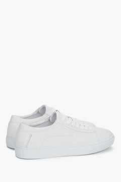 White leather sneakers with a flexible sole for spring and autumn.