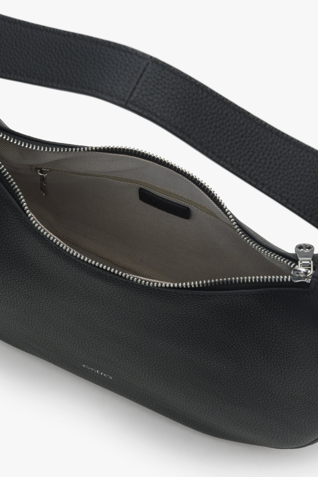Women's black crescent-shaped Estro handbag - close-up on the details.