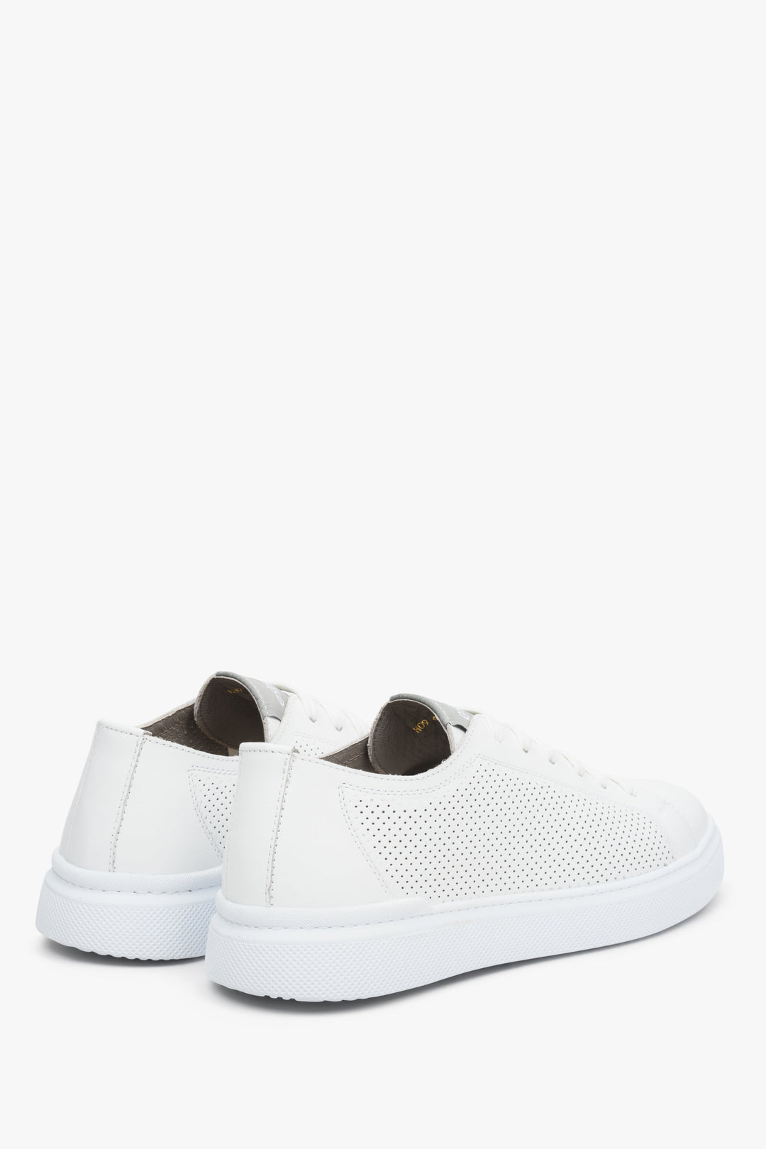 Men's white perforated leather sneakers by Estro - close-up on heel counter and sideline.
