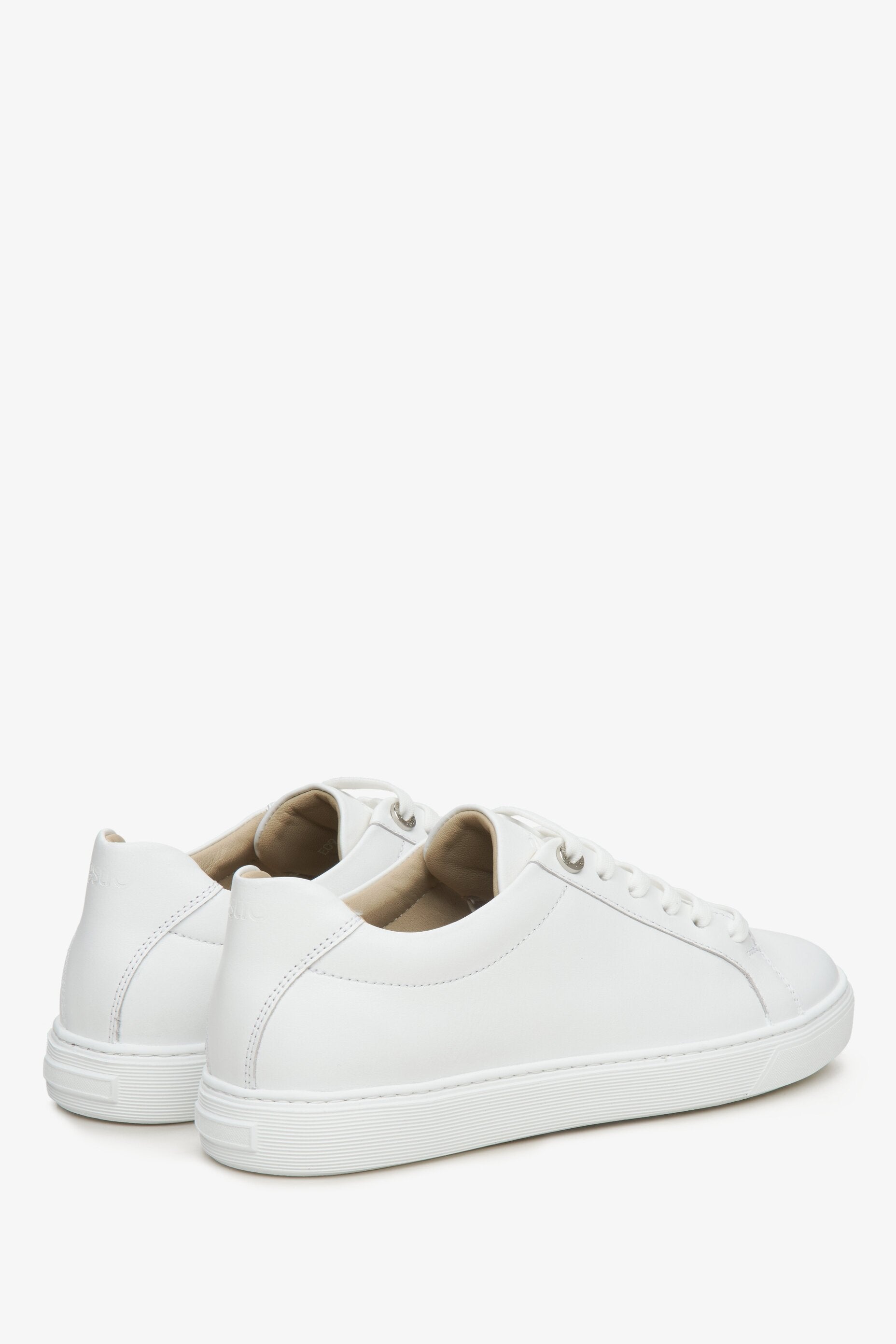 Women's lace-up white sneakers by Estro - close-up on the side seam and heel.