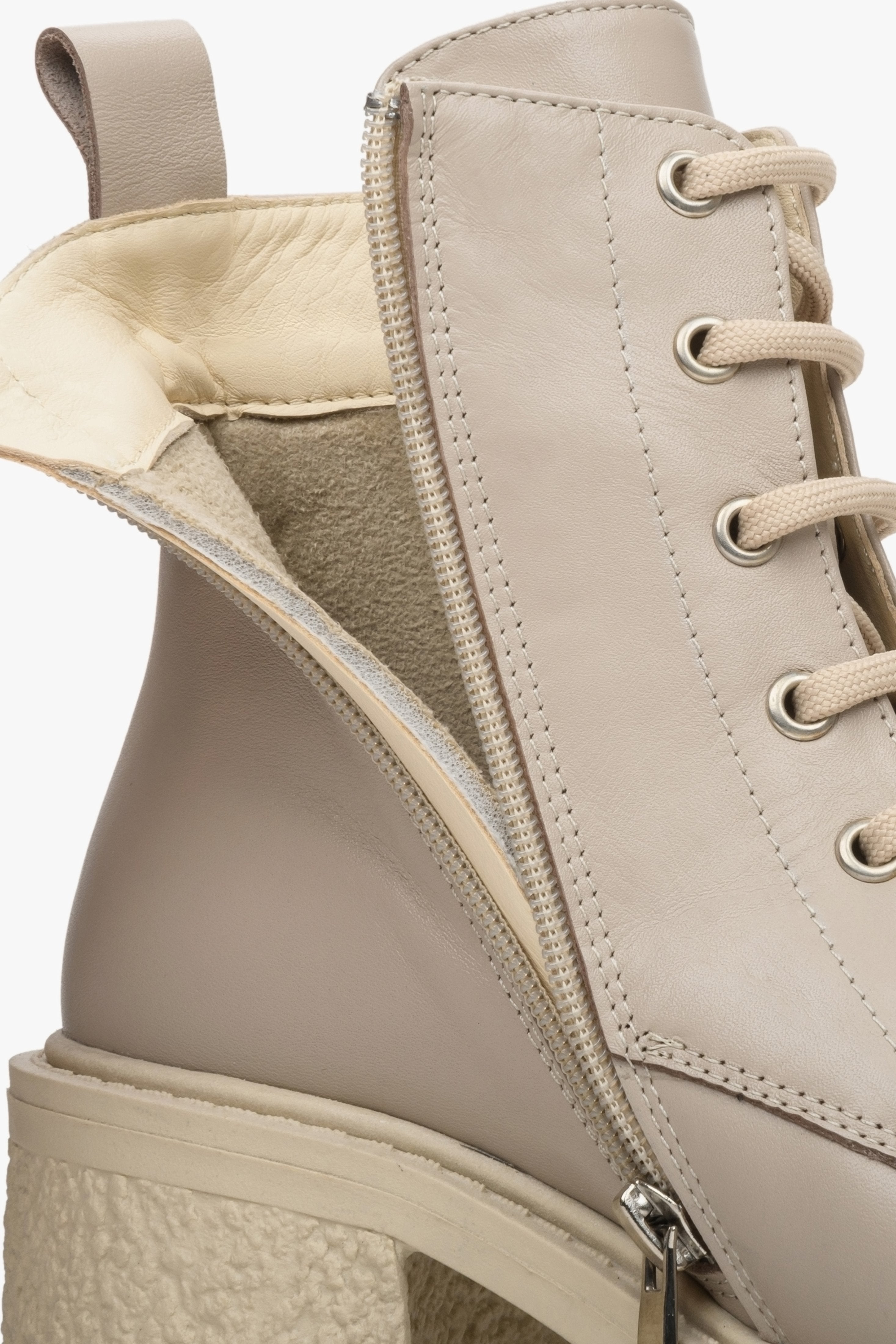 Beige leather Estro women's ankle boots with a stable heel - close-up of the instep.