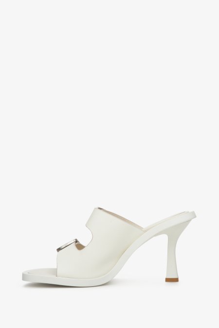 Women's white stiletto mules from Estro with a buckle - shoe profile.