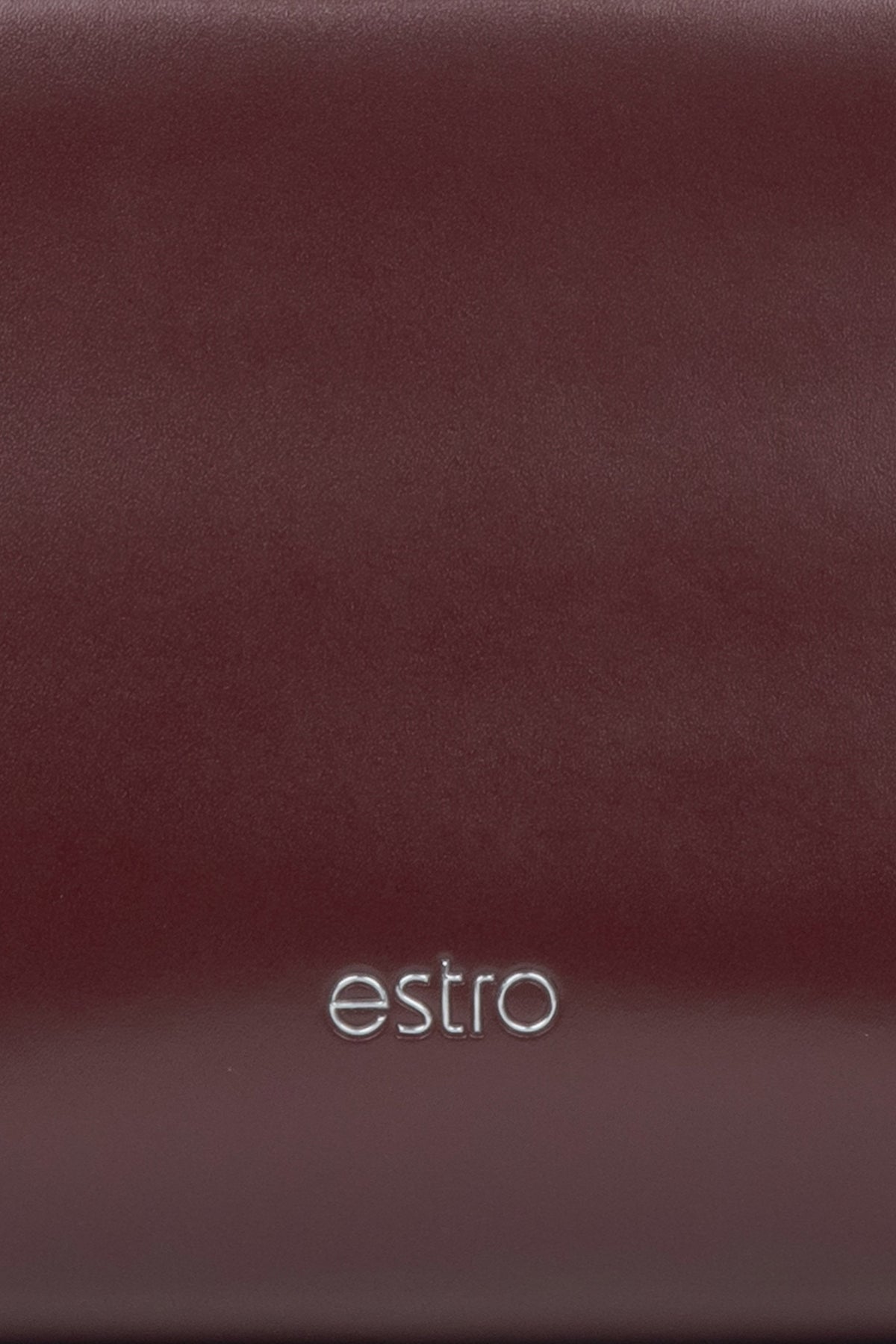 Women's burgundy leather handbag - a close-up on details.