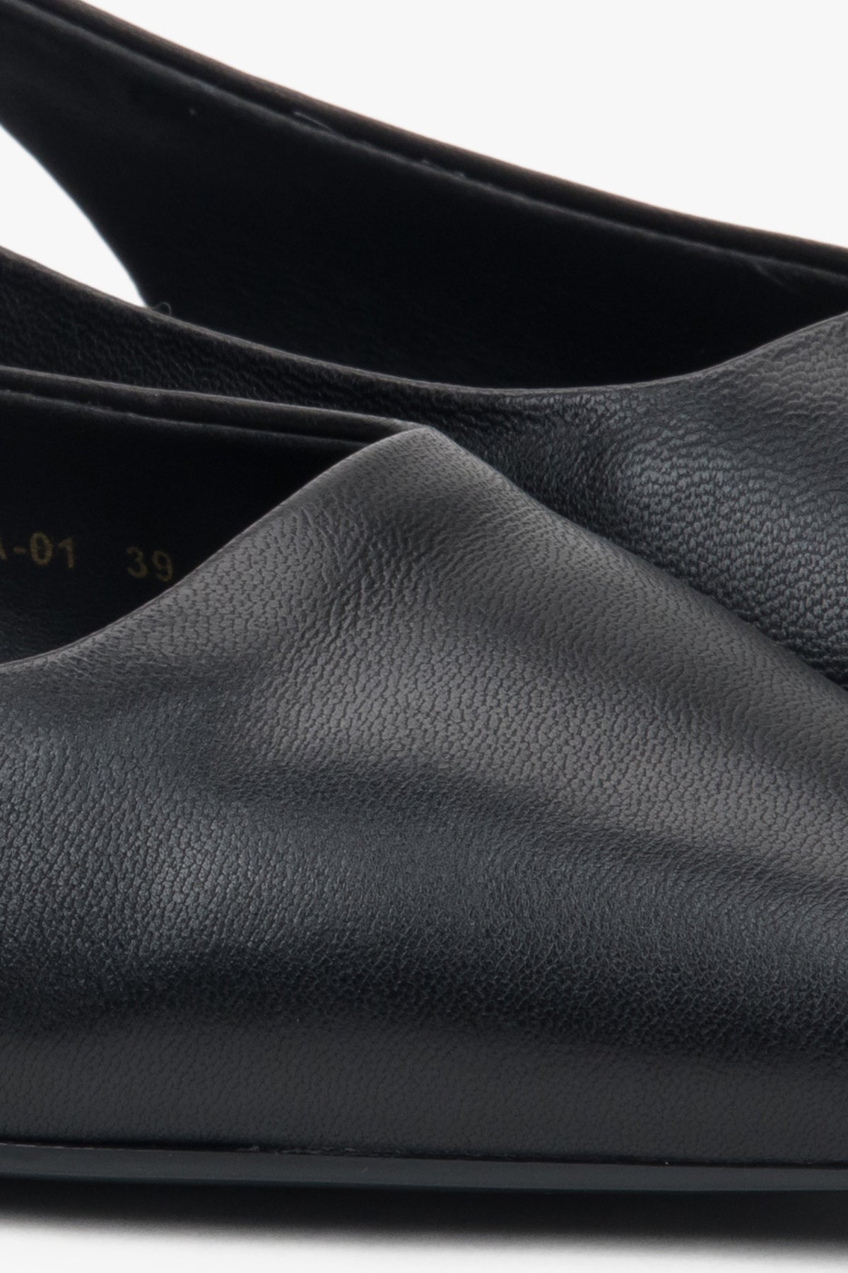 Stylish women's slingback sandals with black detailing and a pointed toe.
