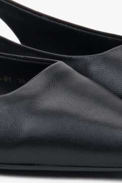 Stylish women's slingback sandals with black detailing and a pointed toe.