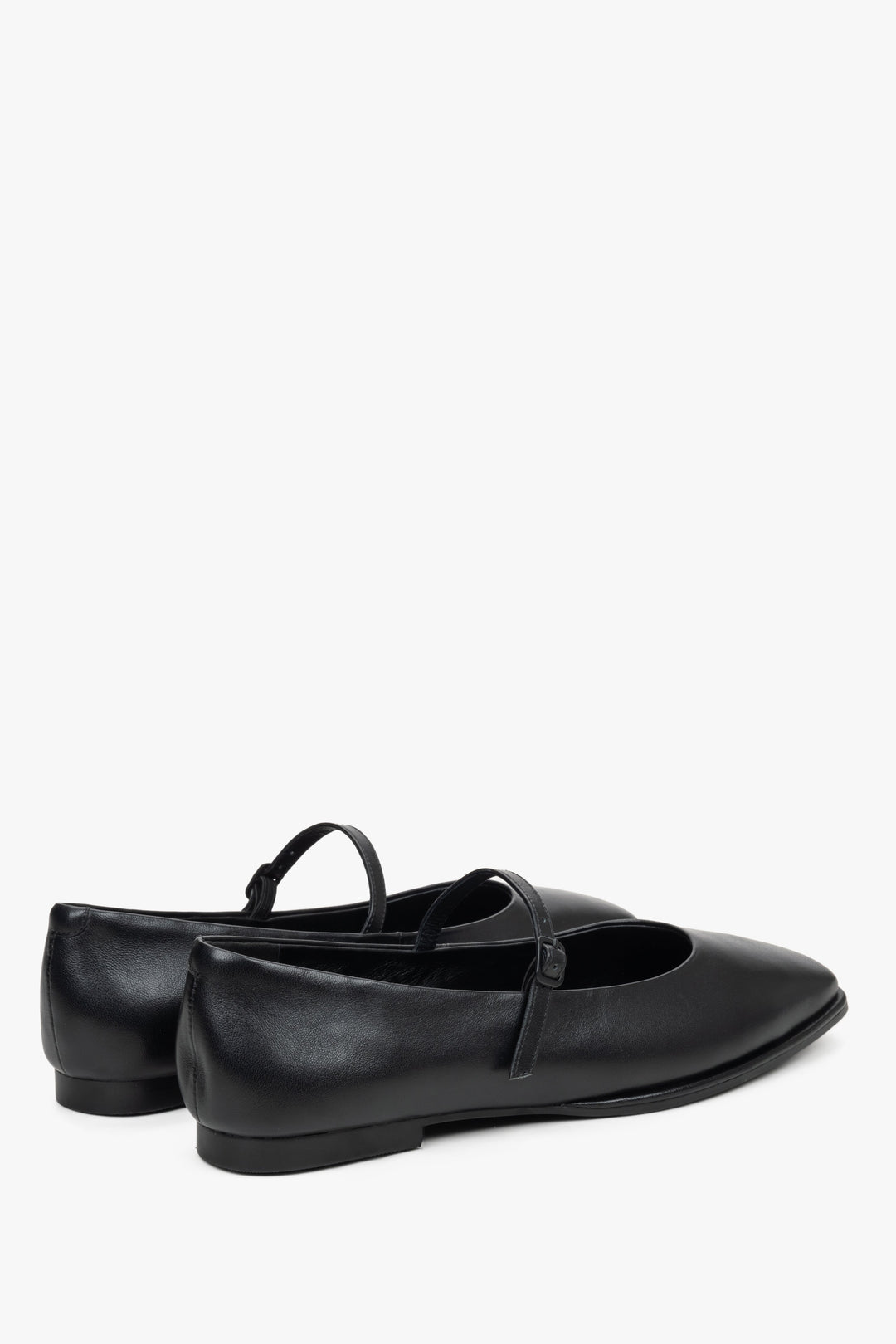Women's black leather ballet flats by Estro - close-up on the heel and side line of the shoes.