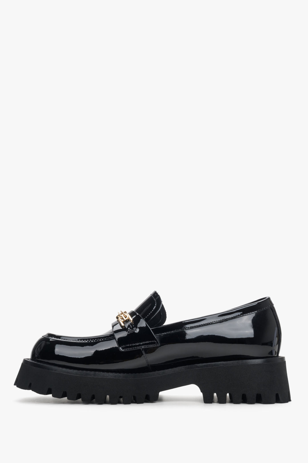 Women's black patent leather moccasins by Estro - side view of the shoe.