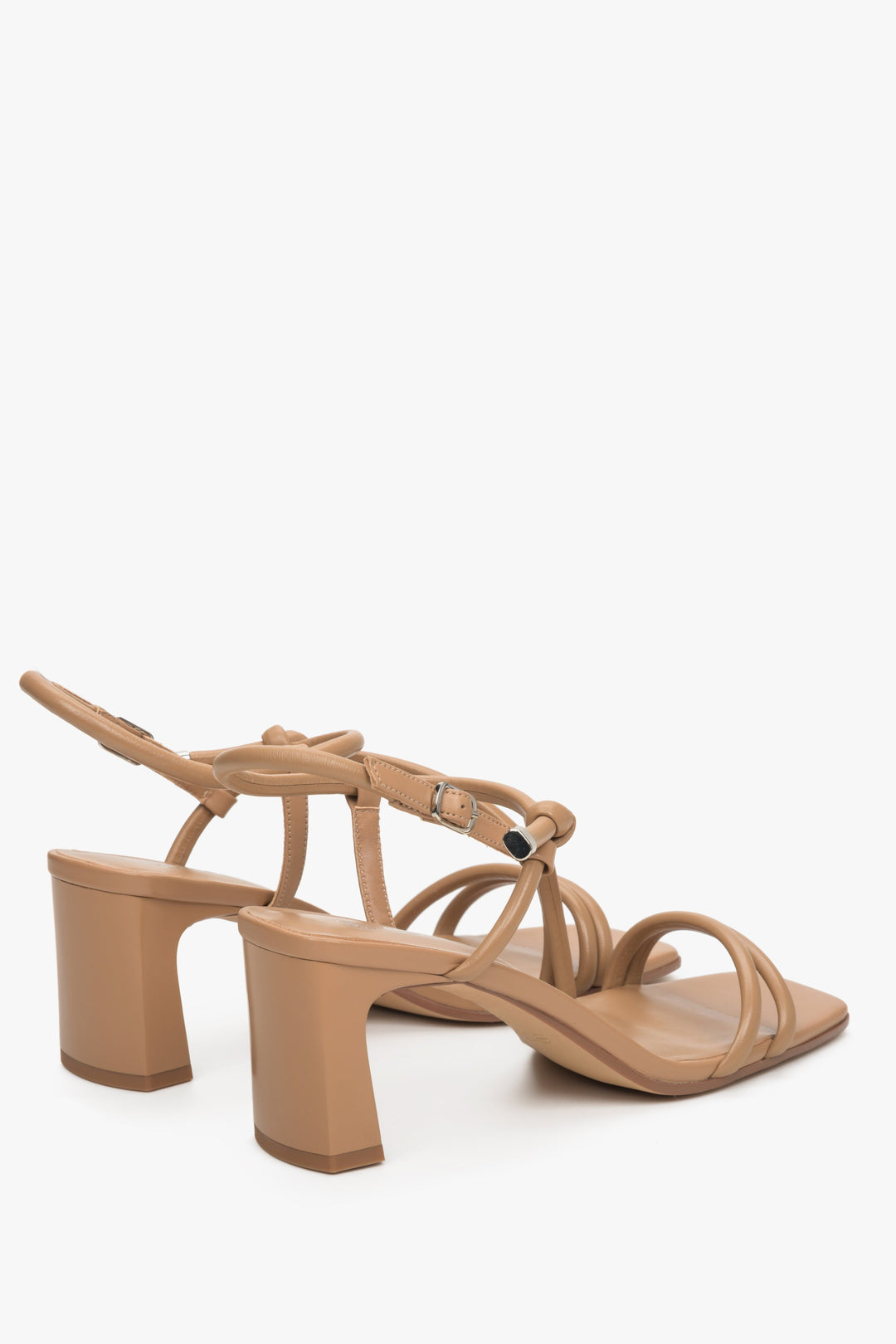 Light brown leather strappy sandals on a block heel, presentation of the heel and sideline.