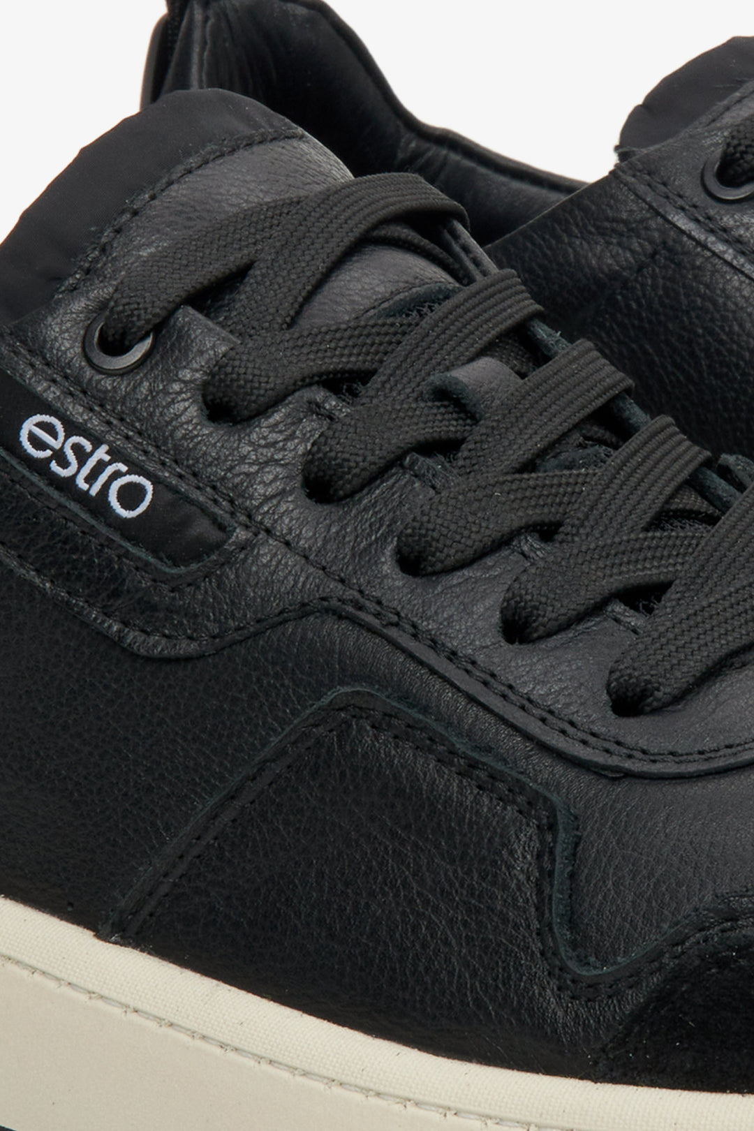 Men's black low-top sneakers - a close-up on details.