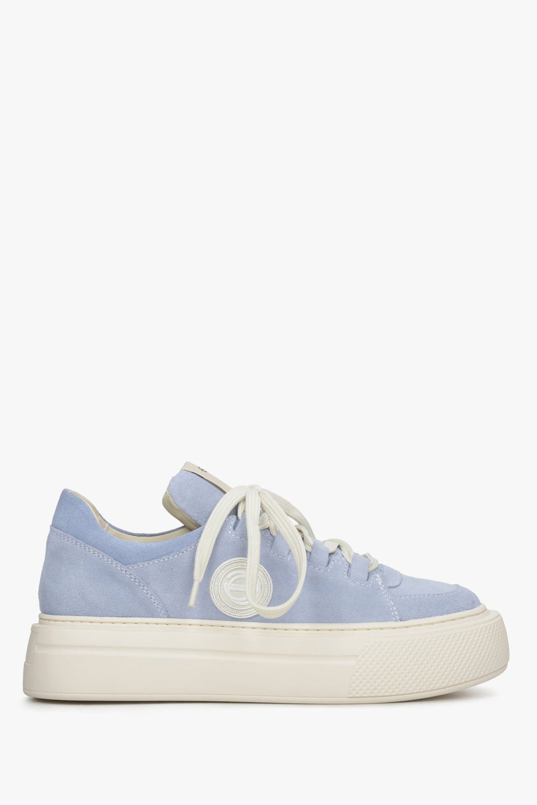Women's blue sneakers on a thick sole - shoe profile.