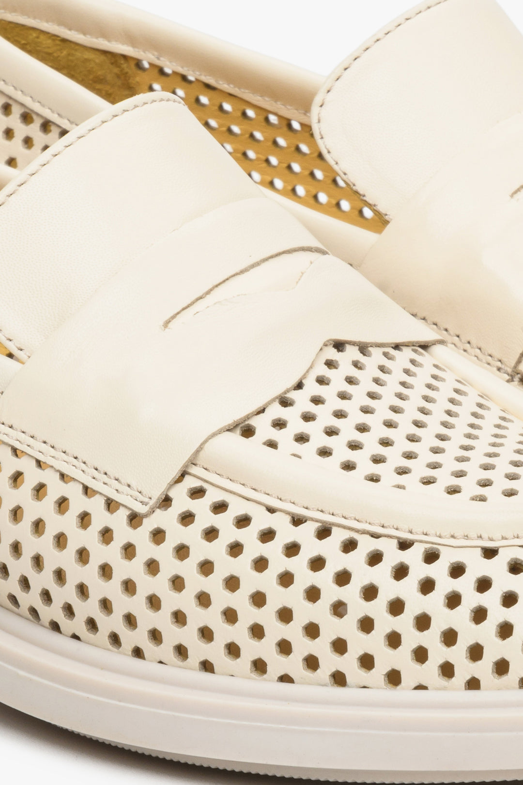 Women's light beige natural leather loafers by Estro - close-up on the stitching and perforation pattern.