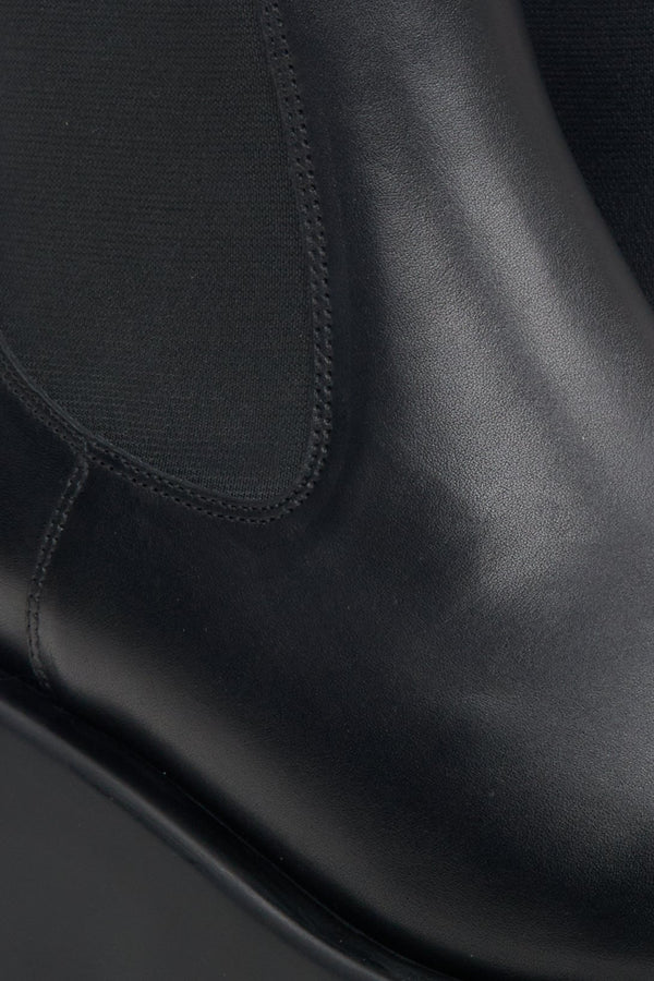 Women's black leather platform  boots - close-up on the detail.