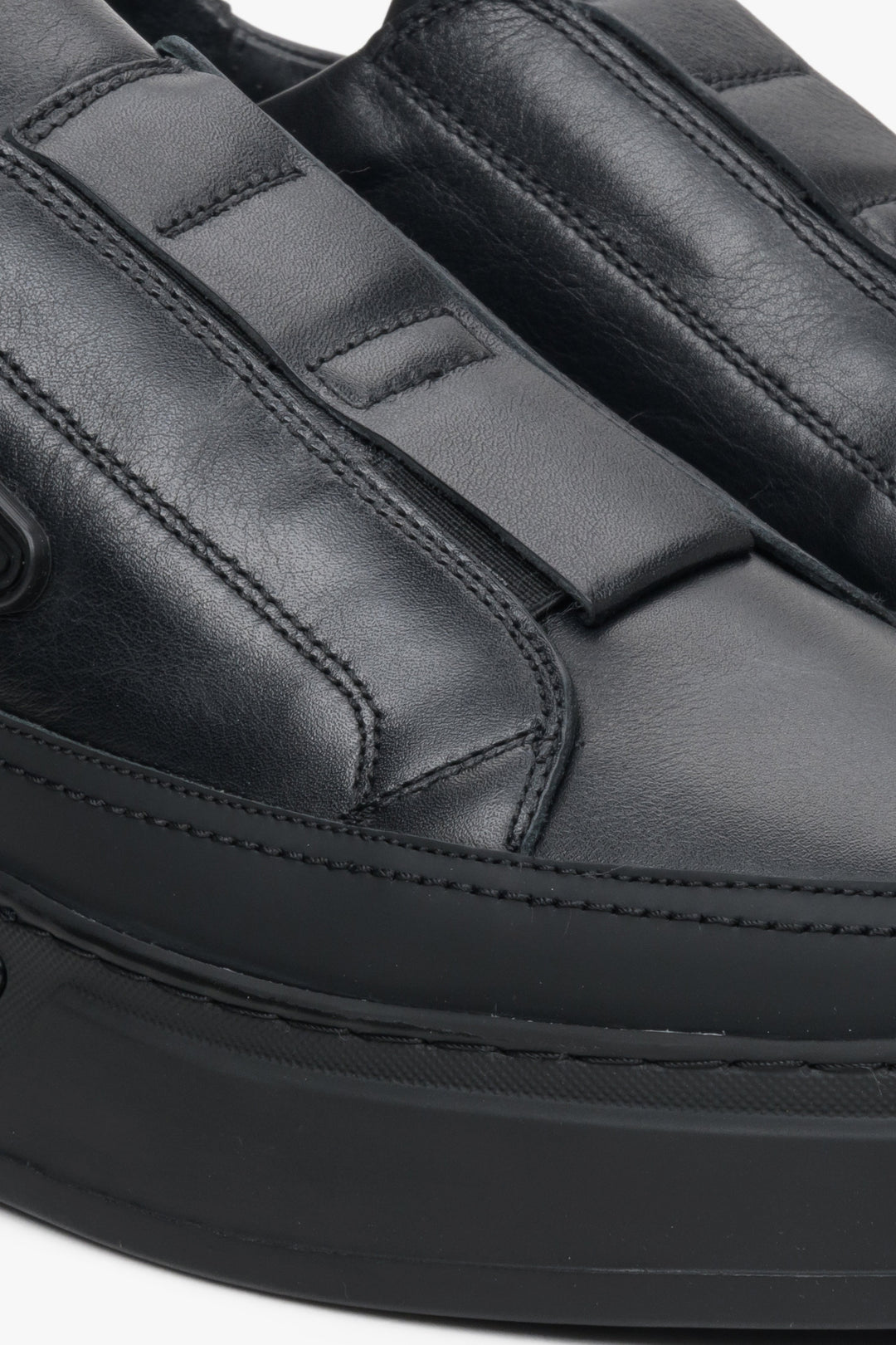 Men's black leather slip-on sneakers by Estro - close-up on the details.