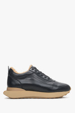 Women's black and beige winter sneakers made of leather and natural fur, Estro brand - side view of the shoe.