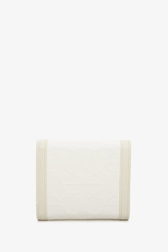 Handy beige Estro women's wallet - back side of the model.