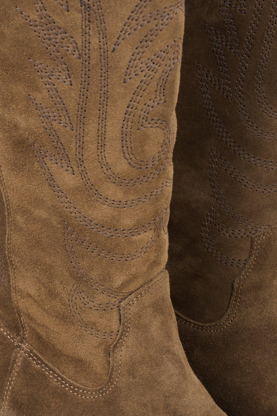 Women's brown cowboy boots with embellishments made of genuine Italian suede - close-up on the details.
