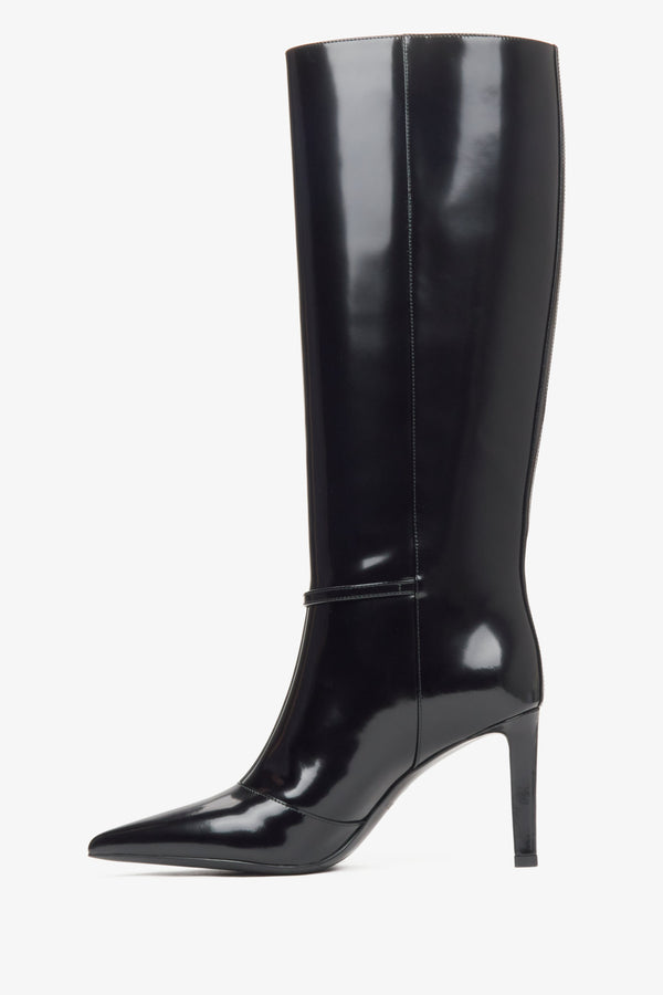 Black patent leather knee-high boots with a high heel from Estro - side profile of the shoe.