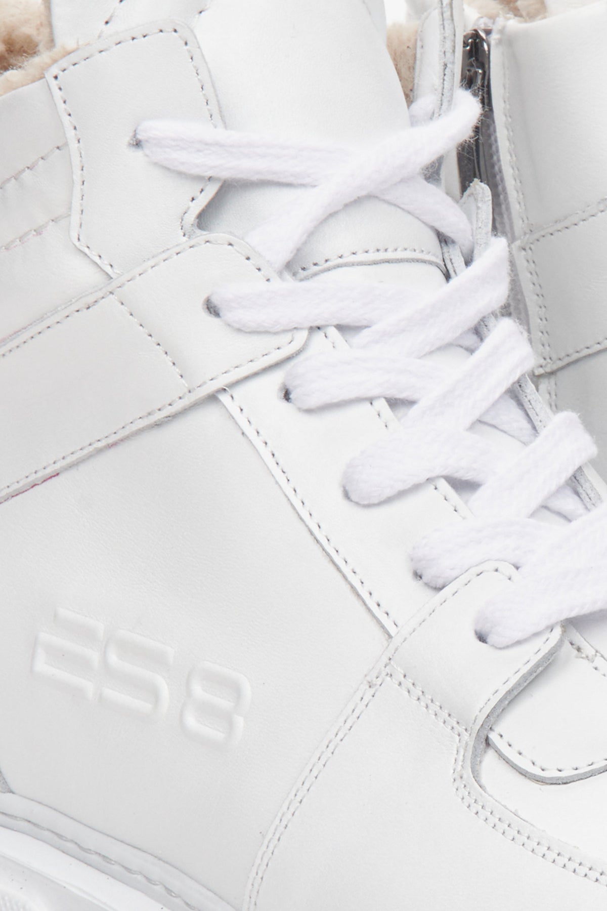 High-top white suede and leather women's sneakers by Estro - close-up on the interior of the model.