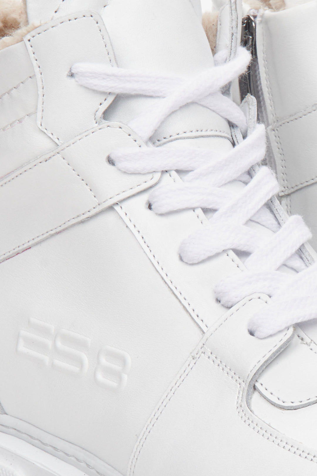 High-top white suede and leather women's sneakers by Estro - close-up on the interior of the model.