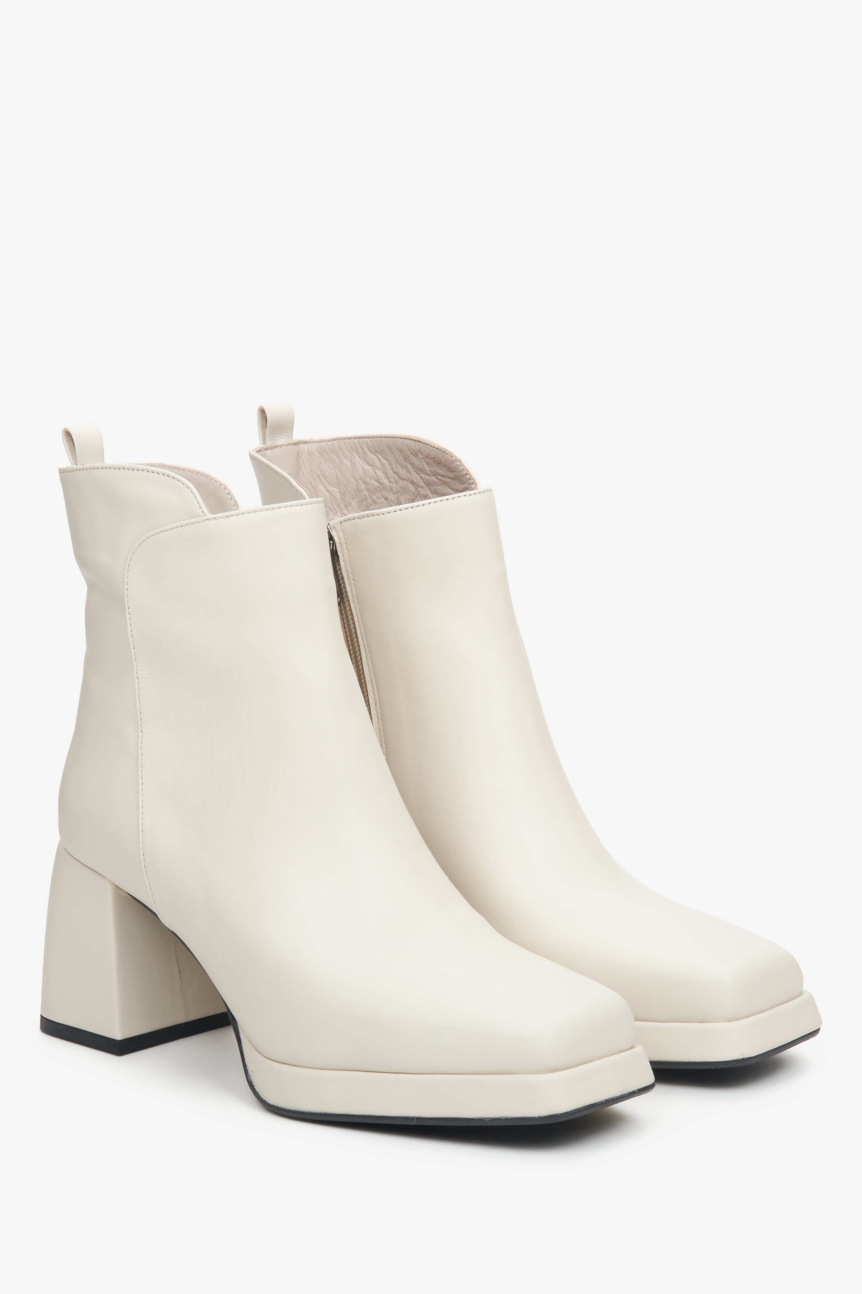 Women's beige leather ankle boots with block heel by Estro - close-up on the toe and side line of the boot.