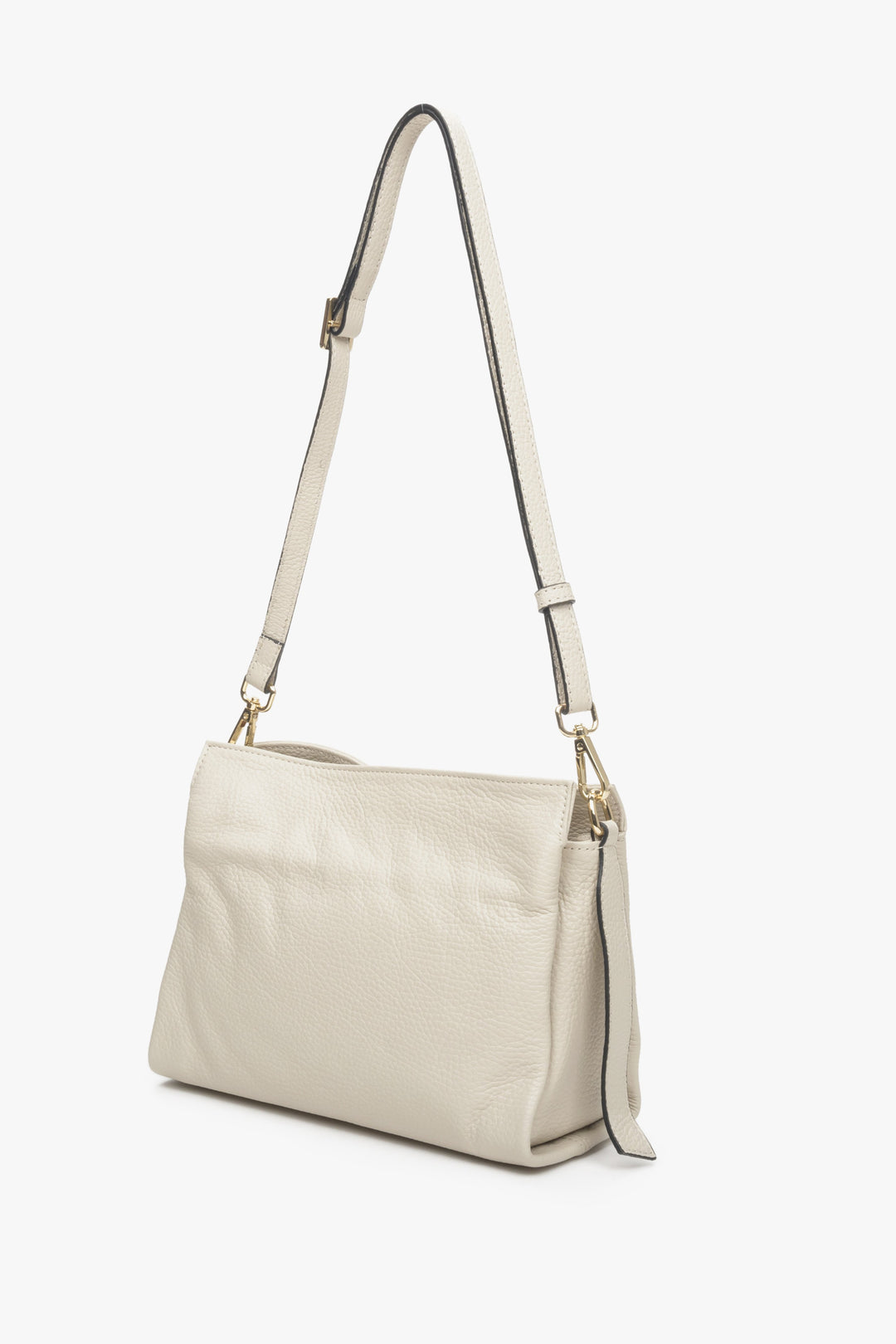 Beige leather women's crossbody bag by Estro with a long strap.