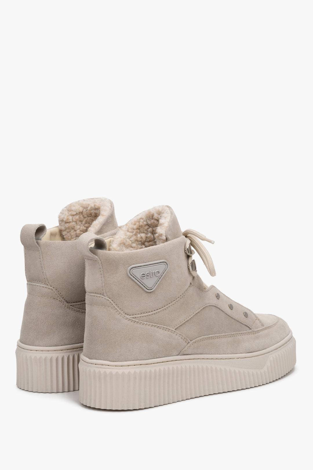 Winter high-top women's sneakers with warm lining by Estro: laced, suede - close-up on the back of the shoe.