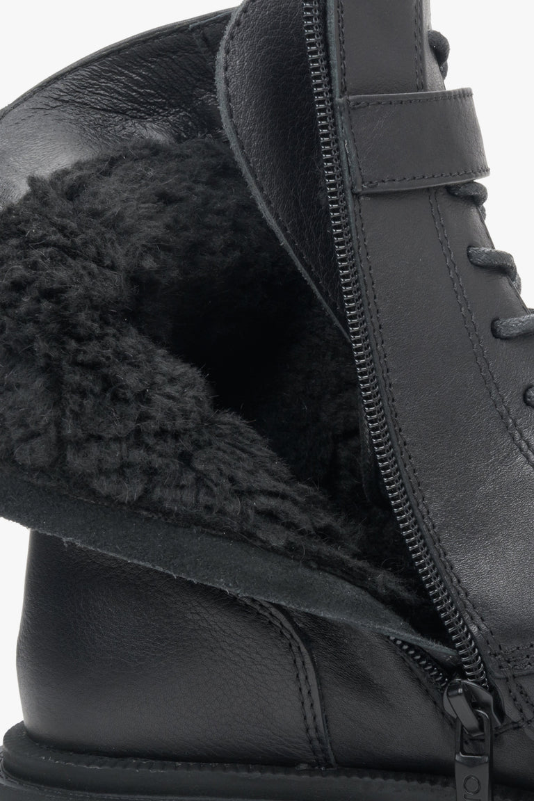 Estro brand women's winter boots with insulation made of genuine leather - close-up on the shoe's insulation.