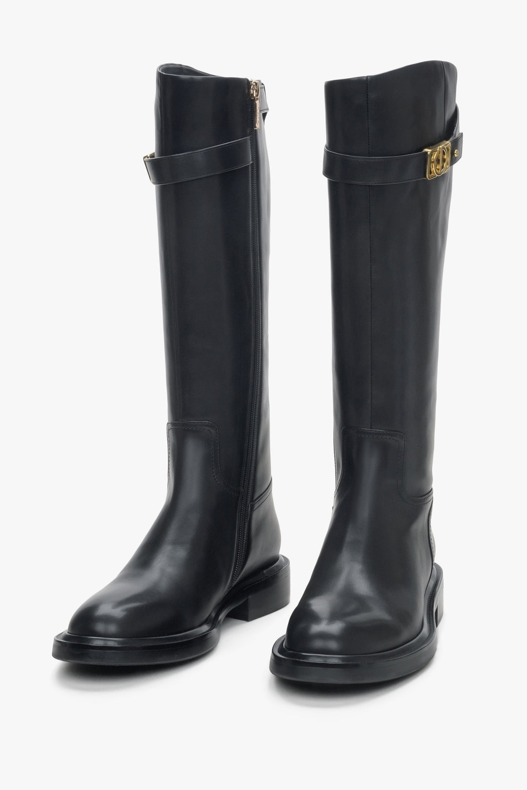 Women's black leather boots by Estro with a decorative strap - front view.