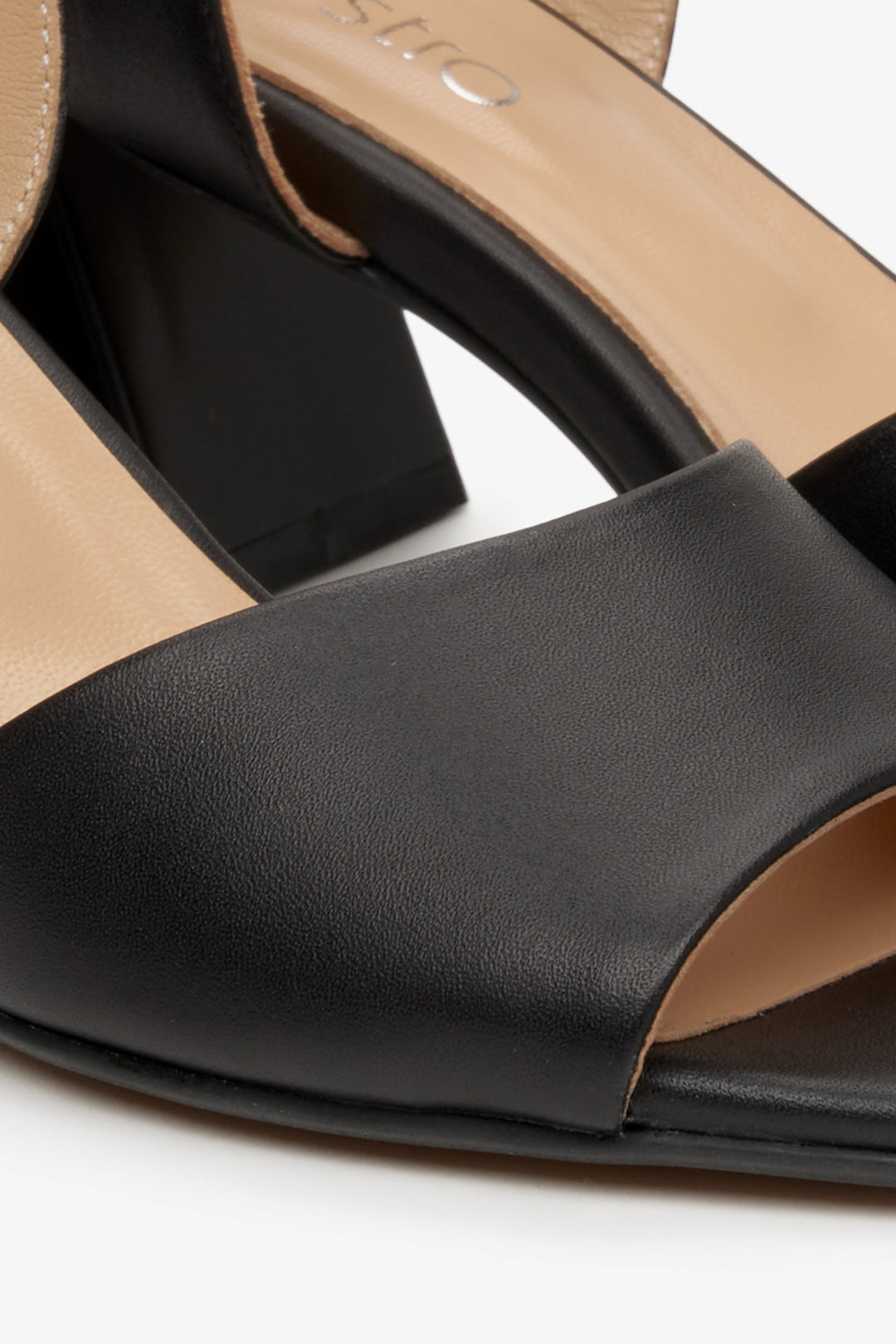 Women's black leather heeled sandals by Estro - a close-up on the details.