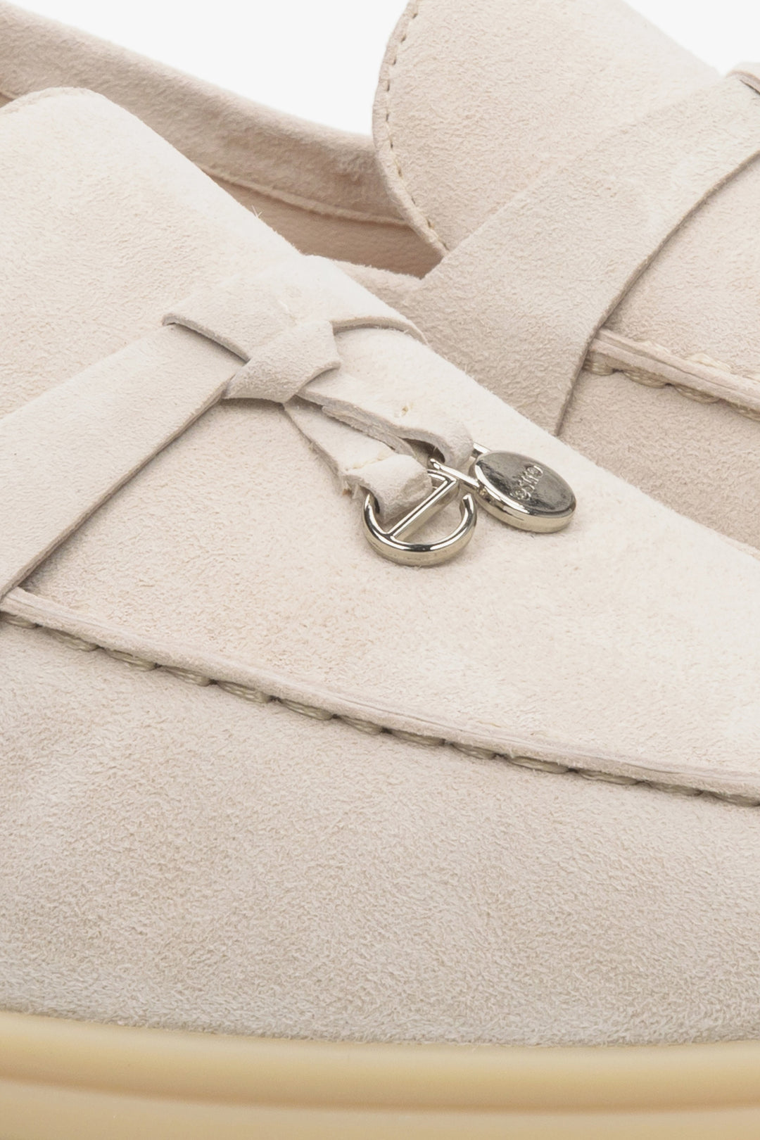 Women's cream beige loafers - a close-up on details.