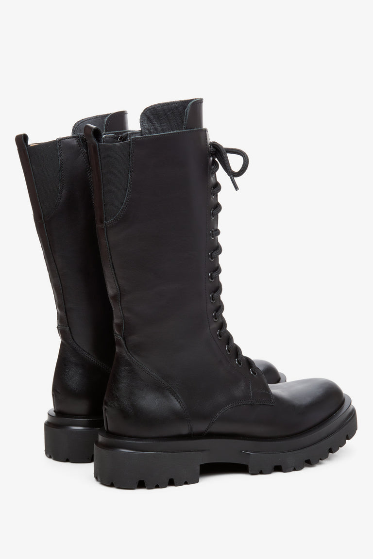 Women's black leather ankle boots by Estro - close-up of the side line and heel of the shoe.