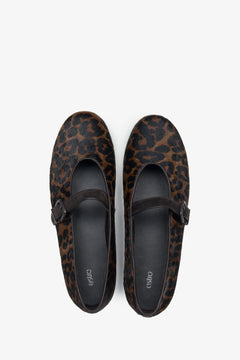 Unique leather ballet flats by Estro, featuring a buckle with a leopard print pattern - top view presentation.