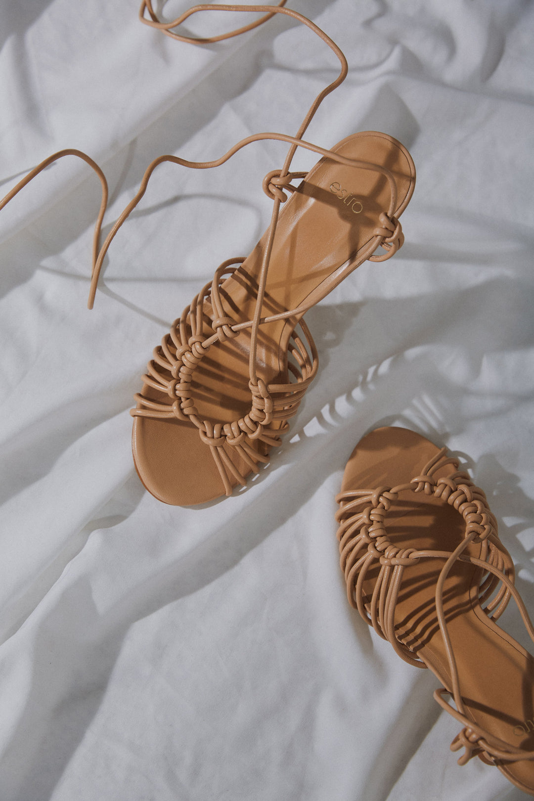Women's beige leather sandals with Estro lace-up.