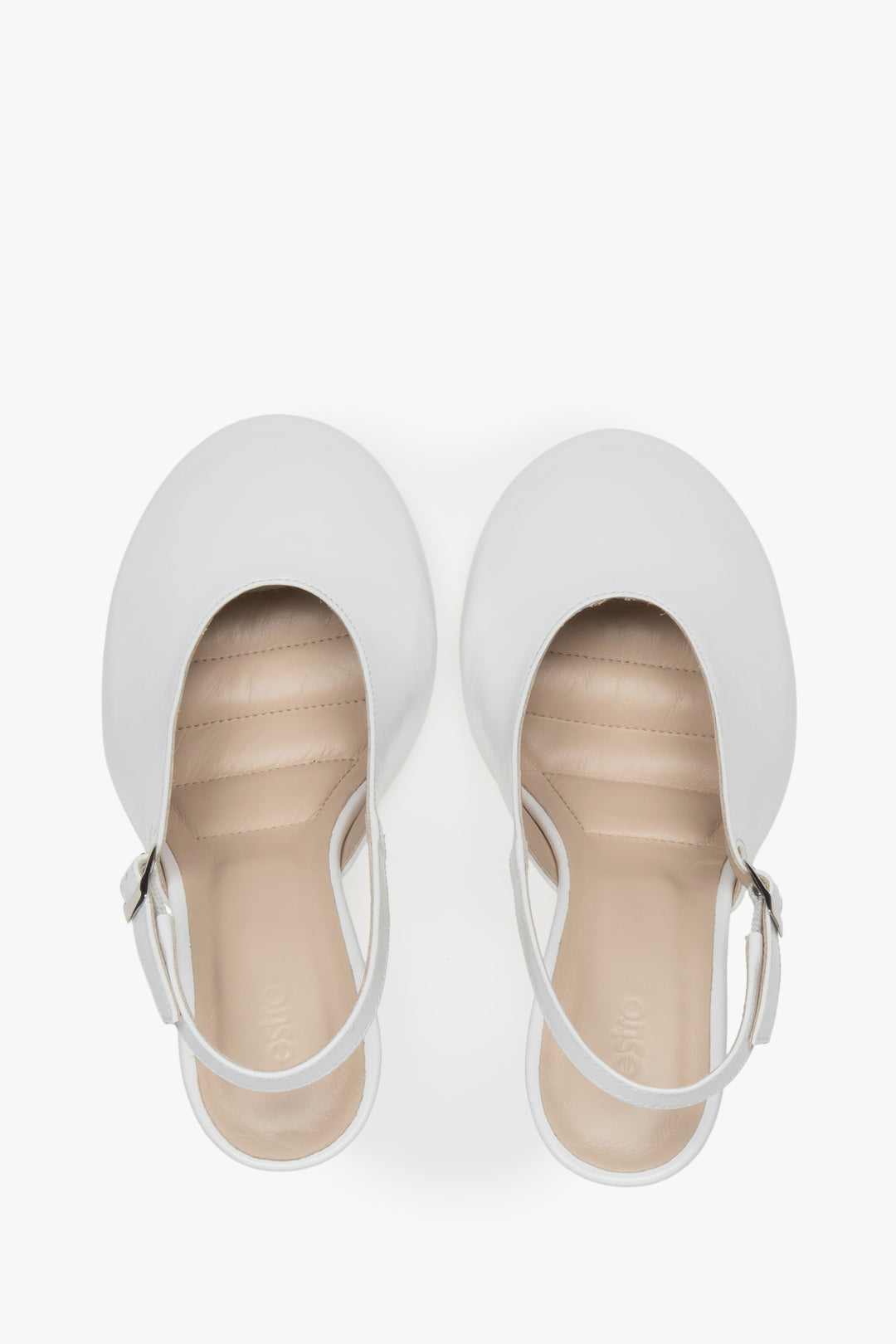 White slingback heels in Italian patent leather.