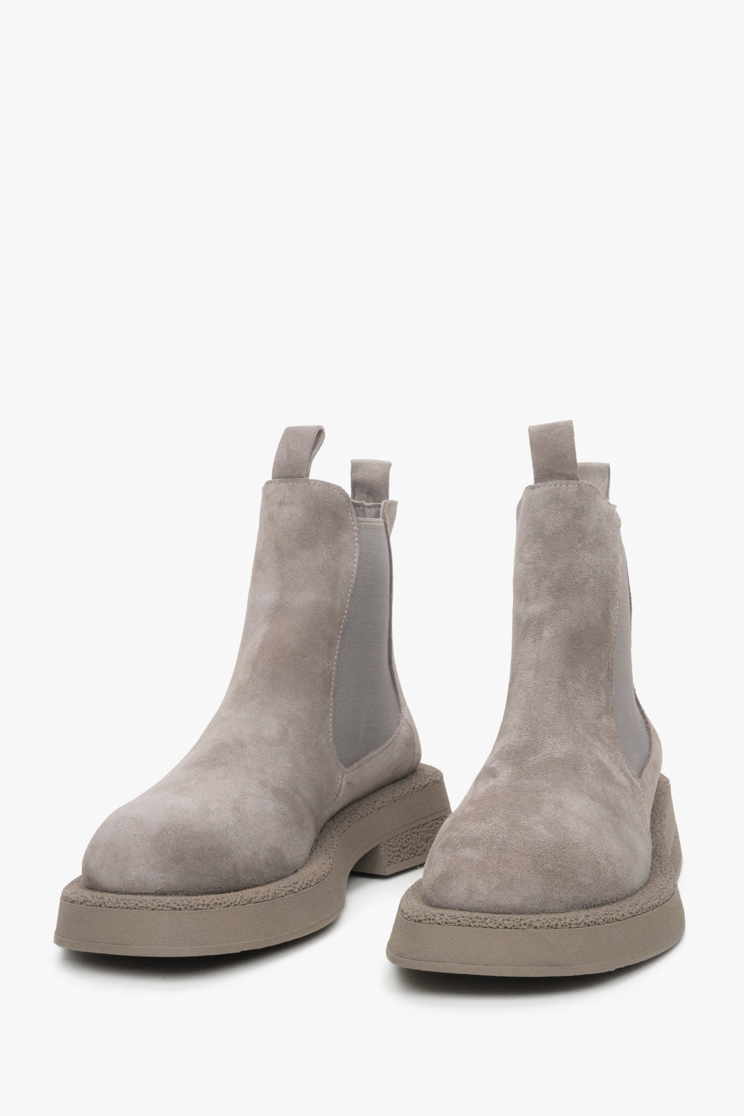 Women's grey Chelsea boots made of genuine suede - a close-up on tip of the shoe.