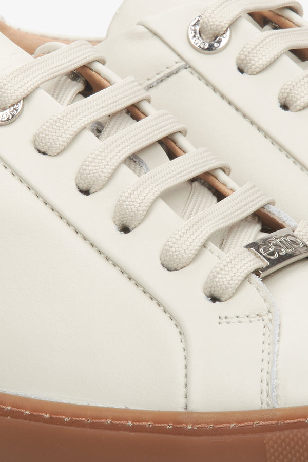 Women's beige leather sneakers by Estro - close-up on details.