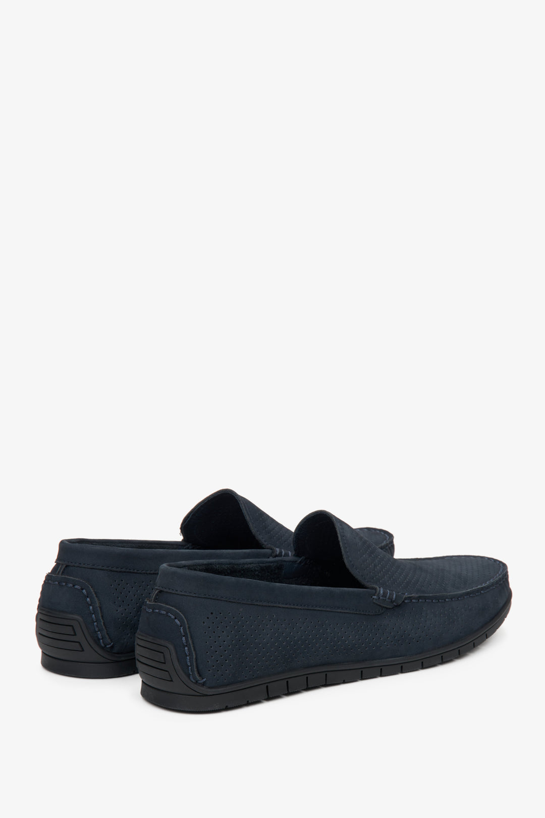 Men's navy blue loafers with perforation - close-up on the heel and side seam of the shoes.