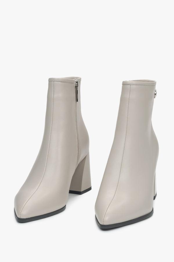 Light beige leather women's ankle boots with a pointed toe and heel by Estro - front view of the model.