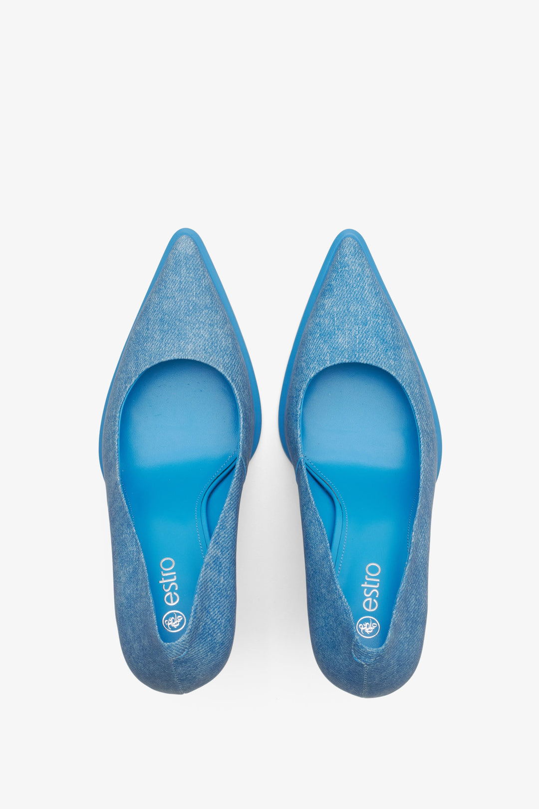 Women's blue denim pumps by Estro - close-up on the heel and side line of the shoes.