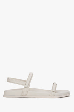 Women's off-white flat sandals made of genuine leather.